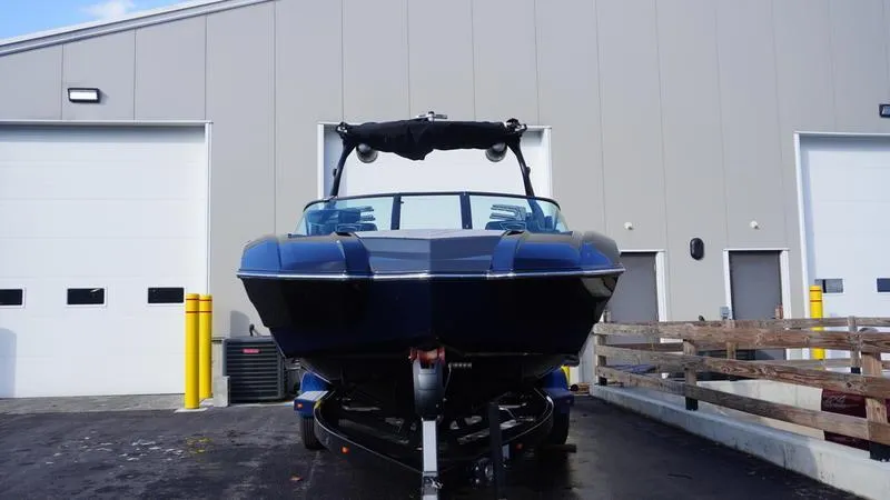 Slide: The Image of 2019 Supra SA boat on trailer outside a warehouse. - 21