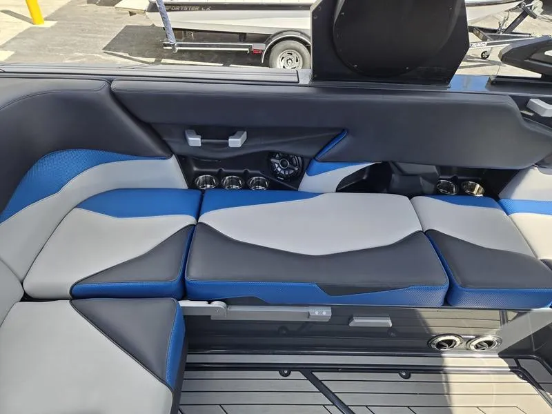 Slide: The Image of 2019 Supra SA boat interior with blue and gray seating, showcasing modern design and comfort. - 8