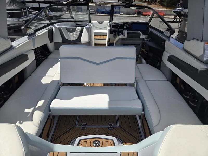 Slide: The Image of 2022 Nautique Super Air Nautique G23 boat interior with luxurious seating and modern design. - 15