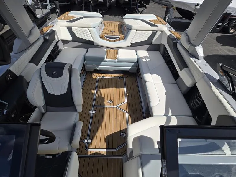 Slide: The Image of Luxurious interior of 2022 Nautique Super Air Nautique G23 boat with elegant seating. - 18
