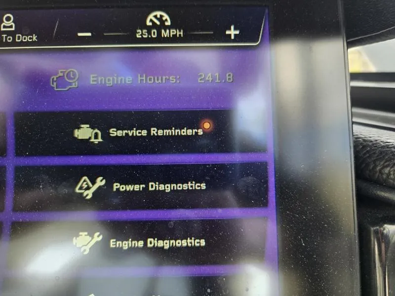 Slide: The Image of Display screen of 2022 Nautique Super Air Nautique G23 showing engine hours and diagnostics. - 20