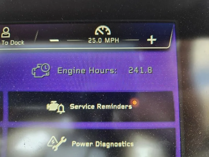 Slide: The Image of Dashboard of 2022 Nautique Super Air Nautique G23 showing 241.8 engine hours. - 21