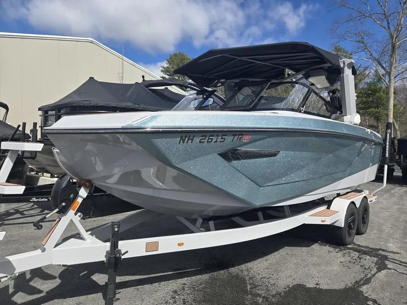 Slide: The Image of 2022 Nautique Super Air Nautique G23 boat on trailer, parked outdoors. - 4