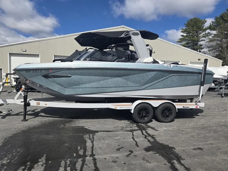 Slide: The Image of 2022 Nautique Super Air Nautique G23 boat on trailer, parked outdoors. - 5