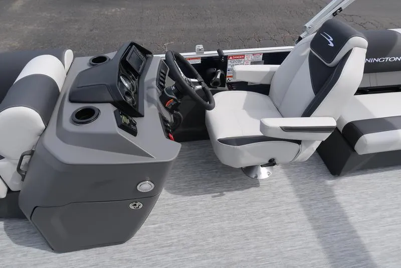 Slide: The Image of 2025 Bennington S Quad Bench 20 SSR boat interior with modern helm and seating. - 14