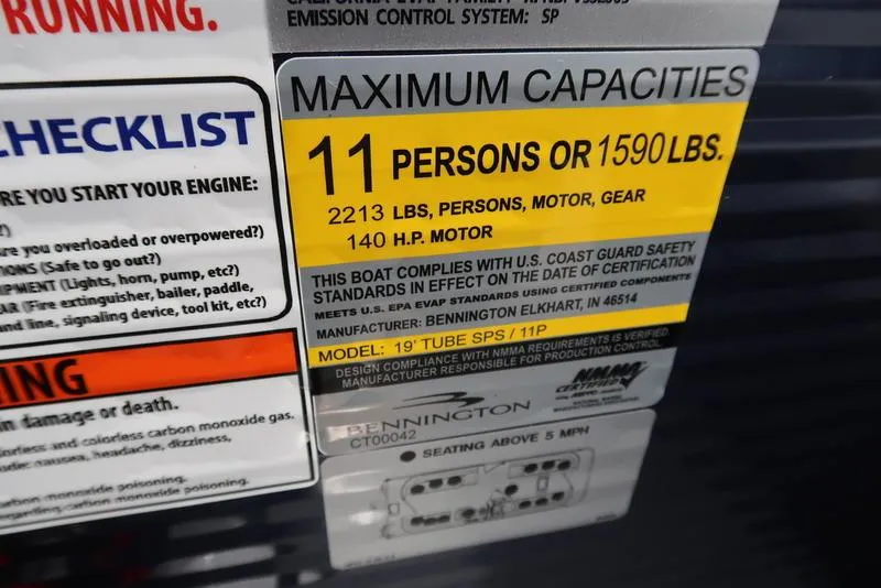Slide: The Image of Capacity label on 2025 Bennington S Quad Bench 20 SSR, max 11 persons or 1590 lbs. - 15
