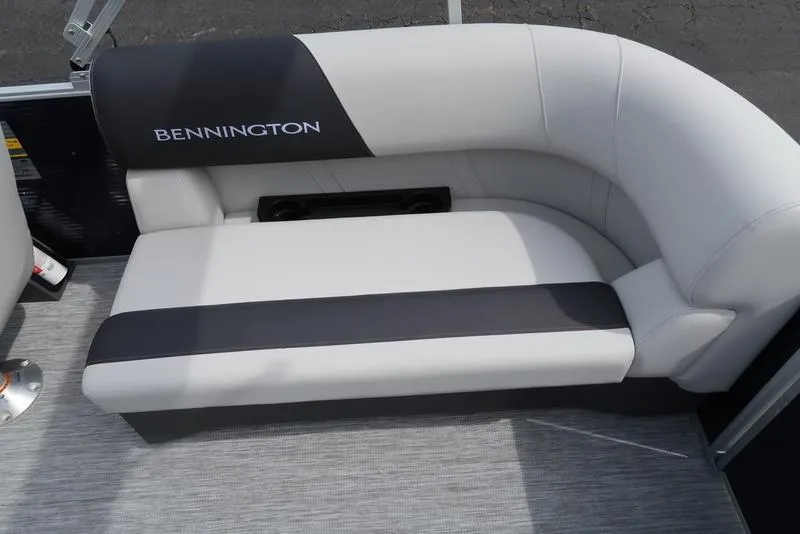 Slide: The Image of 2025 Bennington S Quad Bench 20 SSR boat seat, featuring sleek black and white design. - 21