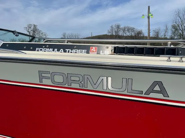 Slide: The Image of 1983 Formula Three LS boat with red and white detailing, side view. - 10