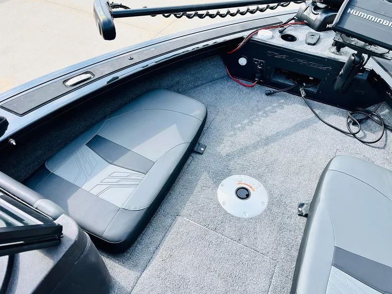Slide: The Image of 2023 Tracker Targa V-19 WT boat interior with gray seating and advanced navigation equipment. - 12