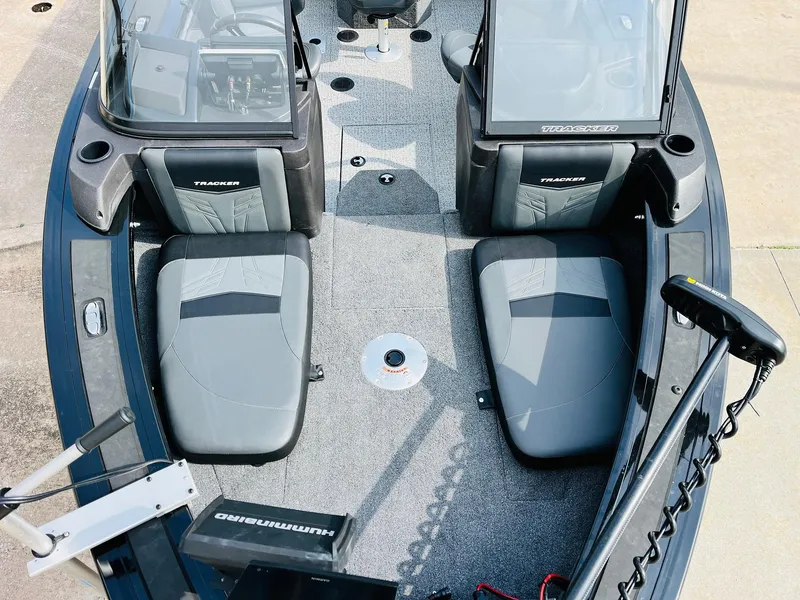 Slide: The Image of 2023 Tracker Targa V-19 WT boat interior with seating and control panels. - 14
