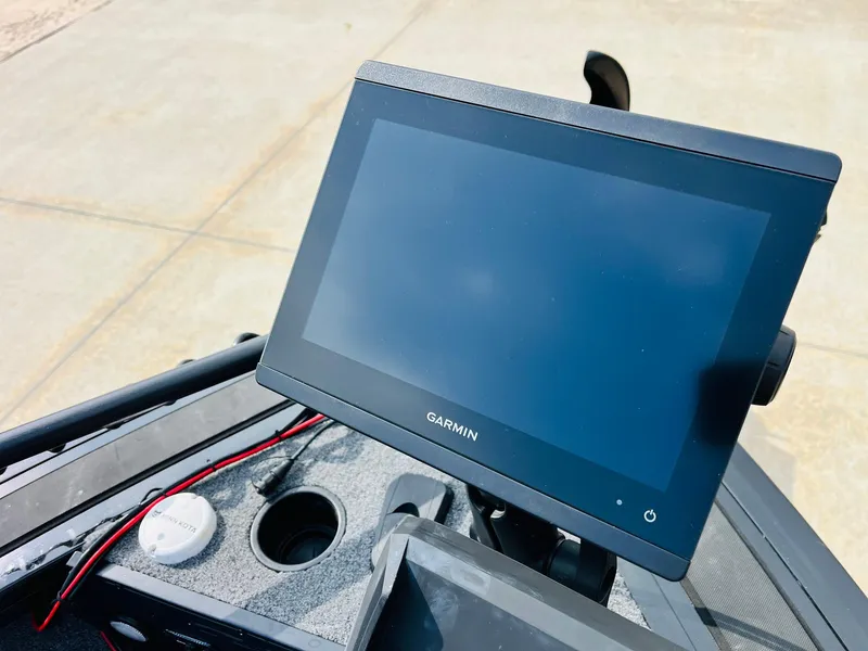 Slide: The Image of Garmin display on 2023 Tracker Targa V-19 WT boat dashboard, featuring modern navigation technology. - 18