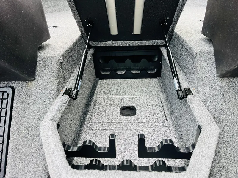 Slide: The Image of 2023 Tracker Targa V-19 WT boat storage compartment with hydraulic lifts and rod holders. - 26