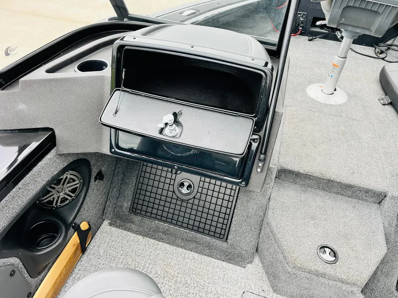 Slide: The Image of 2023 Tracker Targa V-19 WT boat interior with open storage compartment and seating. - 28