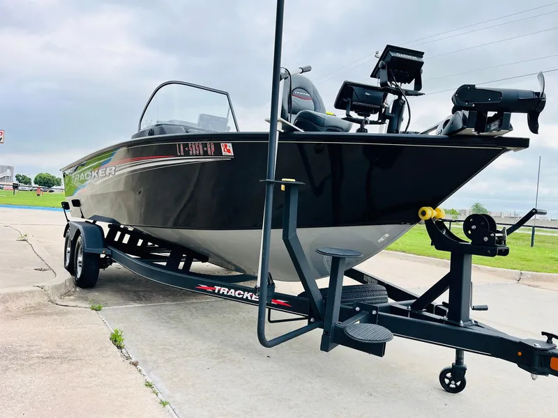 Slide: The Image of 2023 Tracker Targa V-19 WT boat on trailer, parked outdoors. - 3