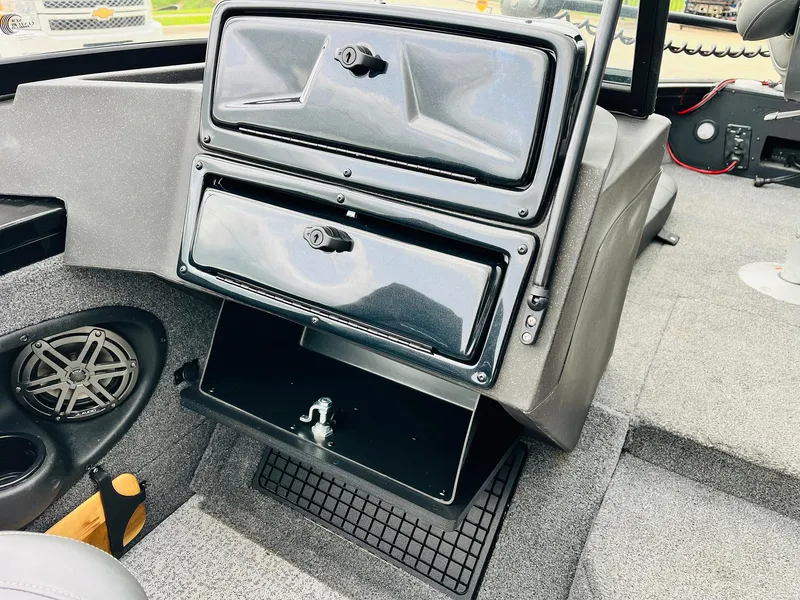Slide: The Image of 2023 Tracker Targa V-19 WT boat interior with storage compartments and speaker. - 30