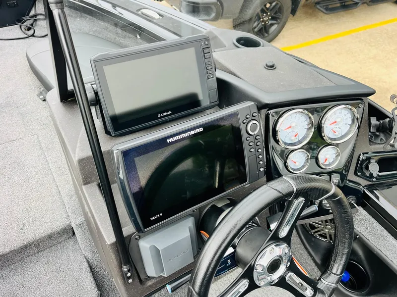 Slide: The Image of 2023 Tracker Targa V-19 WT dashboard with navigation screens and gauges. - 40