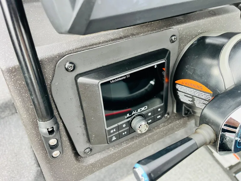 Slide: The Image of Control panel of 2023 Tracker Targa V-19 WT boat featuring JL Audio system. - 41