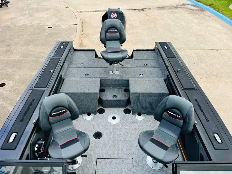 Slide: The Image of 2023 Tracker Targa V-19 WT boat interior with three seats and storage compartments. - 45