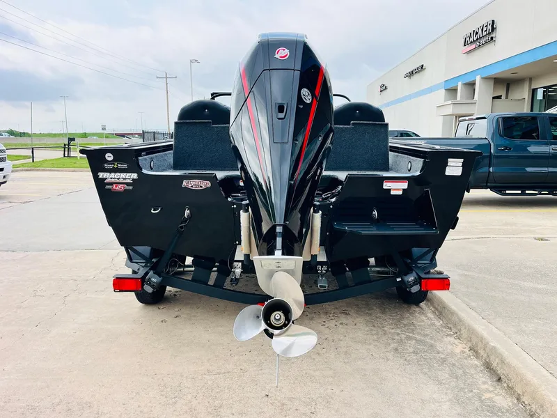Slide: The Image of 2023 Tracker Targa V-19 WT boat, rear view, parked outside dealership. - 6