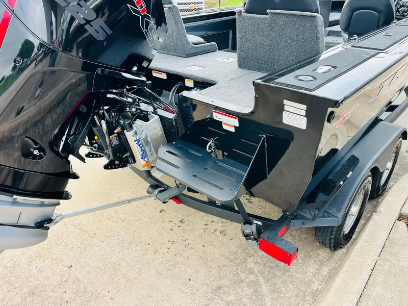 Slide: The Image of 2023 Tracker Targa V-19 WT boat with outboard motor and trailer, rear view. - 8