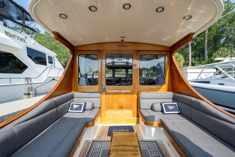 Slide: The Image of Luxurious 2003 Vicem 51 Classic yacht interior with elegant wood finish and comfortable seating. - 10