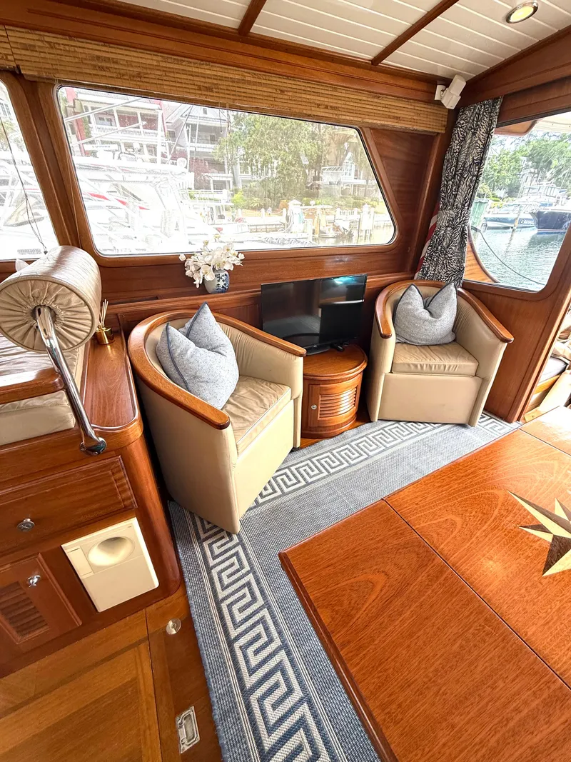 Slide: The Image of Luxurious interior of 2003 Vicem 51 Classic yacht with elegant seating and wooden finishes. - 13