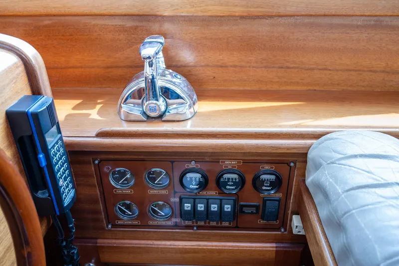 Slide: The Image of Control panel of a 2003 Vicem 51 Classic yacht with gauges and throttle. - 15