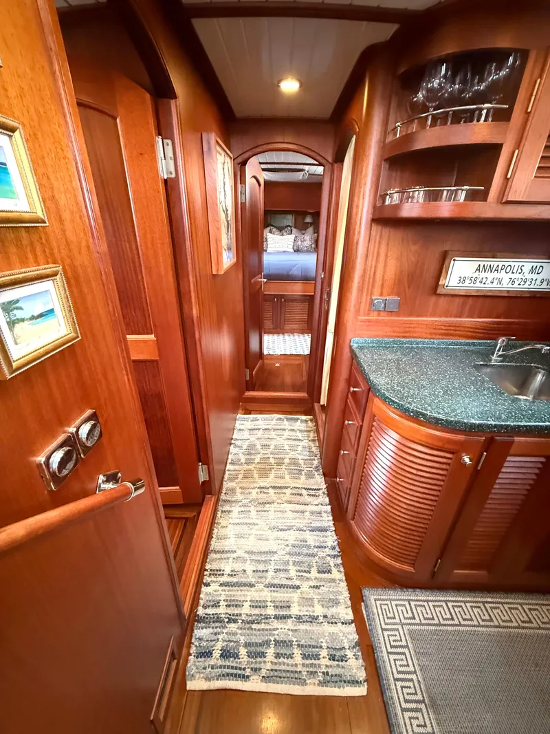 Slide: The Image of Luxurious 2003 Vicem 51 Classic yacht interior with wood finish and elegant decor. - 20