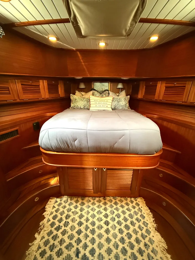 Slide: The Image of Luxurious 2003 Vicem 51 Classic yacht cabin with elegant wood finish and cozy bedding. - 21