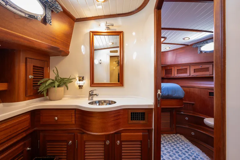 Slide: The Image of Luxurious 2003 Vicem 51 Classic yacht interior with elegant wood finishes and modern amenities. - 23