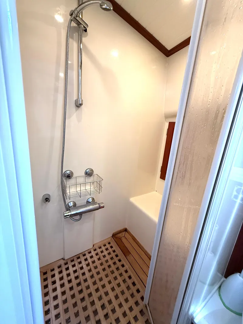 Slide: The Image of Shower area in 2003 Vicem 51 Classic yacht with wooden floor and modern fixtures. - 25