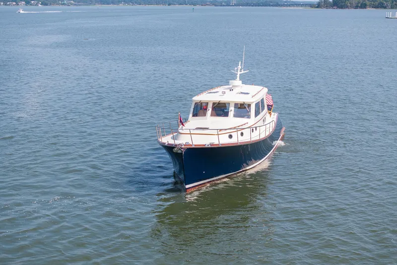 Slide: The Image of 2003 Vicem 51 Classic yacht cruising on calm waters. - 5