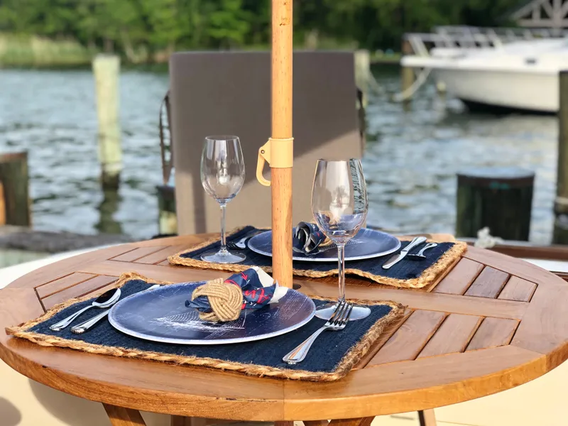 Slide: The Image of Outdoor dining setup on a Vicem 51 Classic yacht, 2003, with water view. - 9