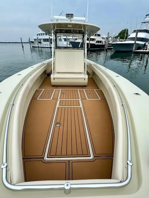 Slide: The Image of 2010 Contender 39 Tournament boat with spacious deck, docked in marina. - 5