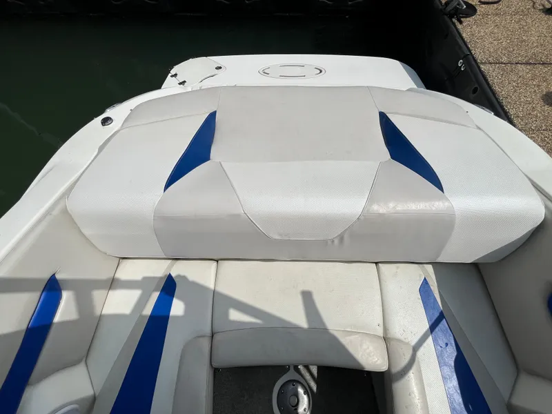 Slide: The Image of 2006 Larson Senza 206 boat interior with white and blue seating. - 11