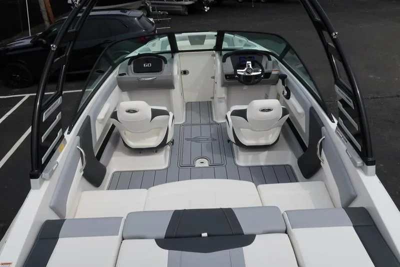 Slide: The Image of 2025 Chaparral 21 SSi boat interior with sleek seating and modern design. - 11