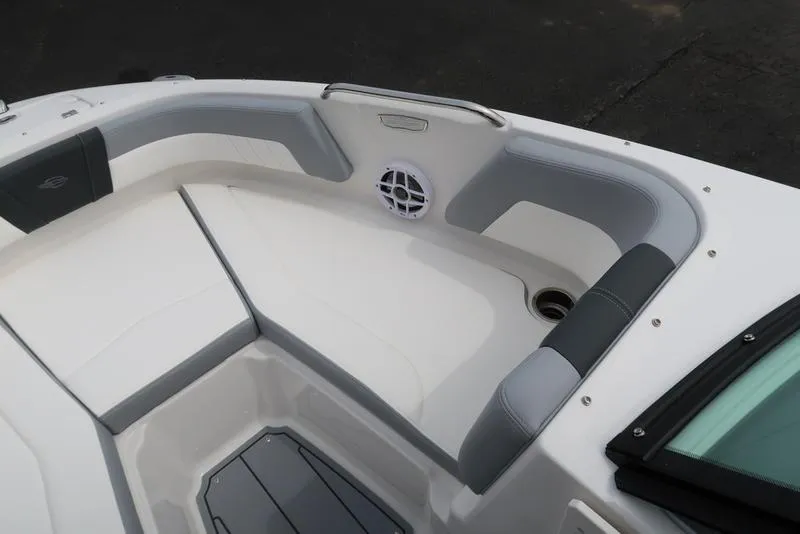 Slide: The Image of 2025 Chaparral 21 SSi boat interior with cushioned seating and speaker. - 12