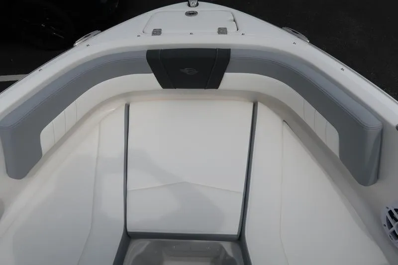 Slide: The Image of Bow seating area of 2025 Chaparral 21 SSi boat with gray and white upholstery. - 14