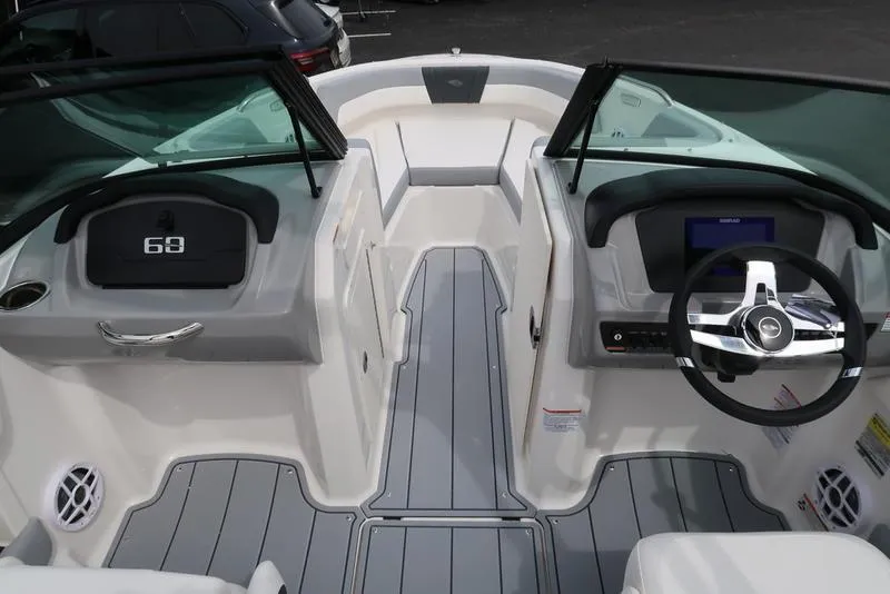 Slide: The Image of 2025 Chaparral 21 SSi boat interior with modern dashboard and steering wheel. - 21