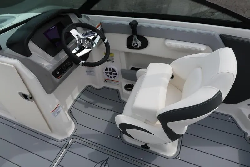 Slide: The Image of 2025 Chaparral 21 SSi boat interior with steering wheel and captain's chair. - 22