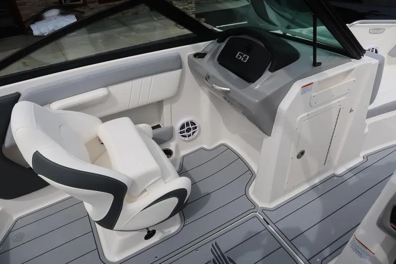Slide: The Image of 2025 Chaparral 21 SSi boat interior with modern dashboard and seating. - 25
