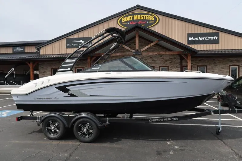 Slide: The Image of 2025 Chaparral 21 SSi boat on trailer outside dealership. - 3