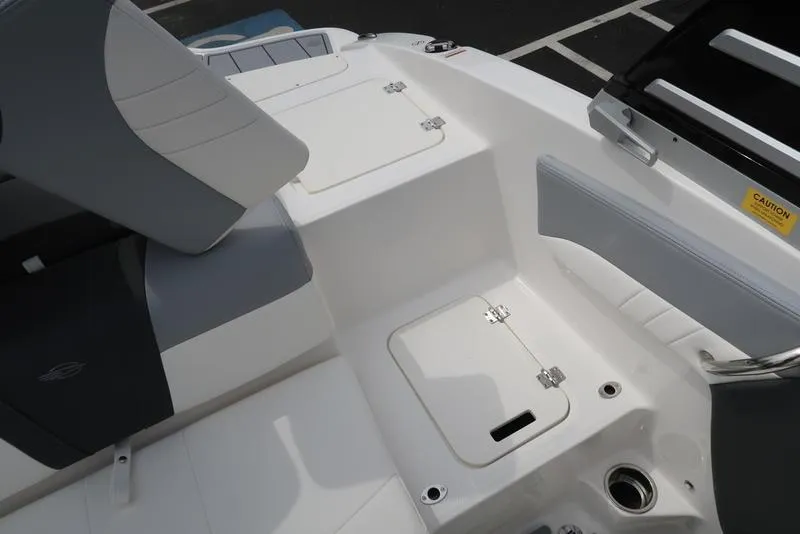 Slide: The Image of 2025 Chaparral 21 SSi boat interior with seating and storage compartments. - 35