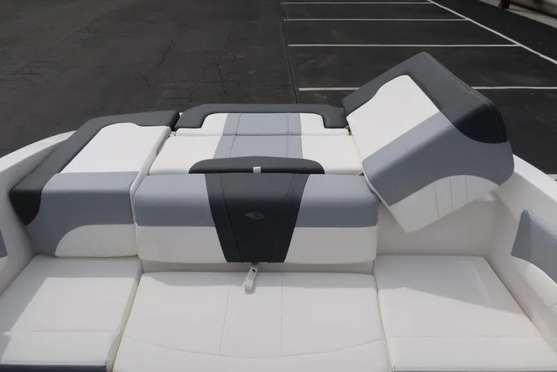 Slide: The Image of 2025 Chaparral 21 SSi boat interior with gray and white seating. - 37