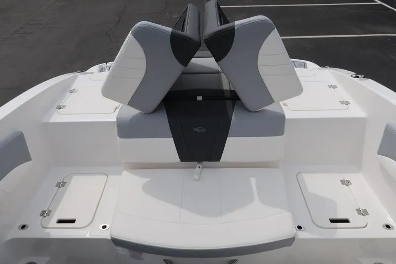 Slide: The Image of 2025 Chaparral 21 SSi boat with sleek white and gray seating, rear view. - 38
