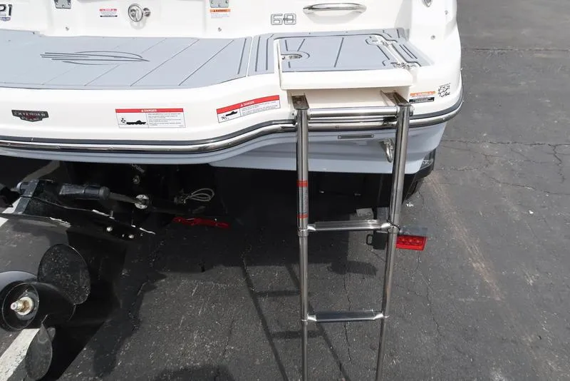 Slide: The Image of 2025 Chaparral 21 SSi boat with extended swim platform and ladder. - 43