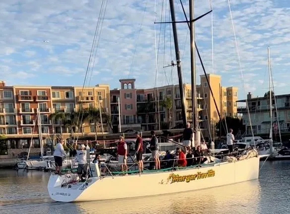 Slide: The Image of Sailboat "Modified In 2003 SLP 52" docked near colorful waterfront buildings, 1989 model. - 29