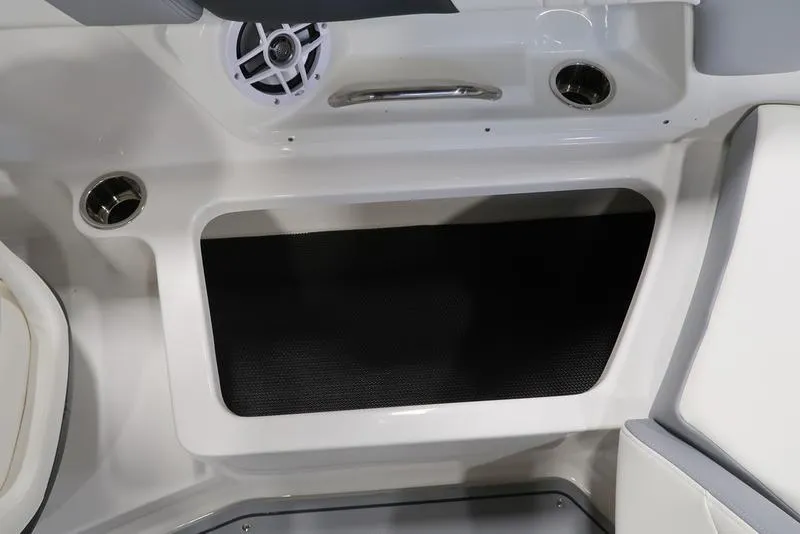 Slide: The Image of Interior view of 2025 Chaparral 23 SSi boat, featuring speaker and storage compartment. - 17