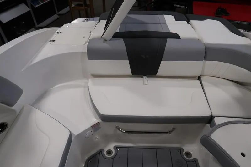 Slide: The Image of 2025 Chaparral 23 SSi boat interior with white and gray seating. - 18