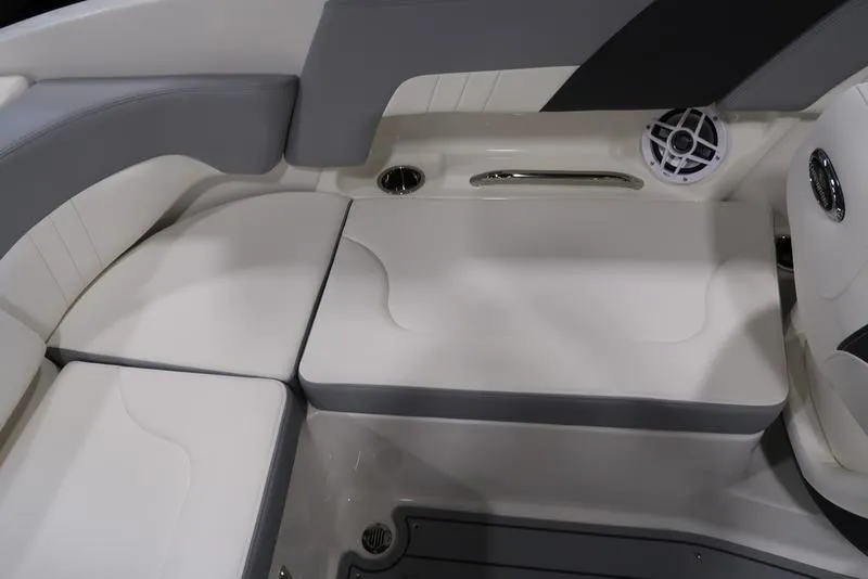 Slide: The Image of 2025 Chaparral 23 SSi boat interior seating with speaker and cup holder. - 19
